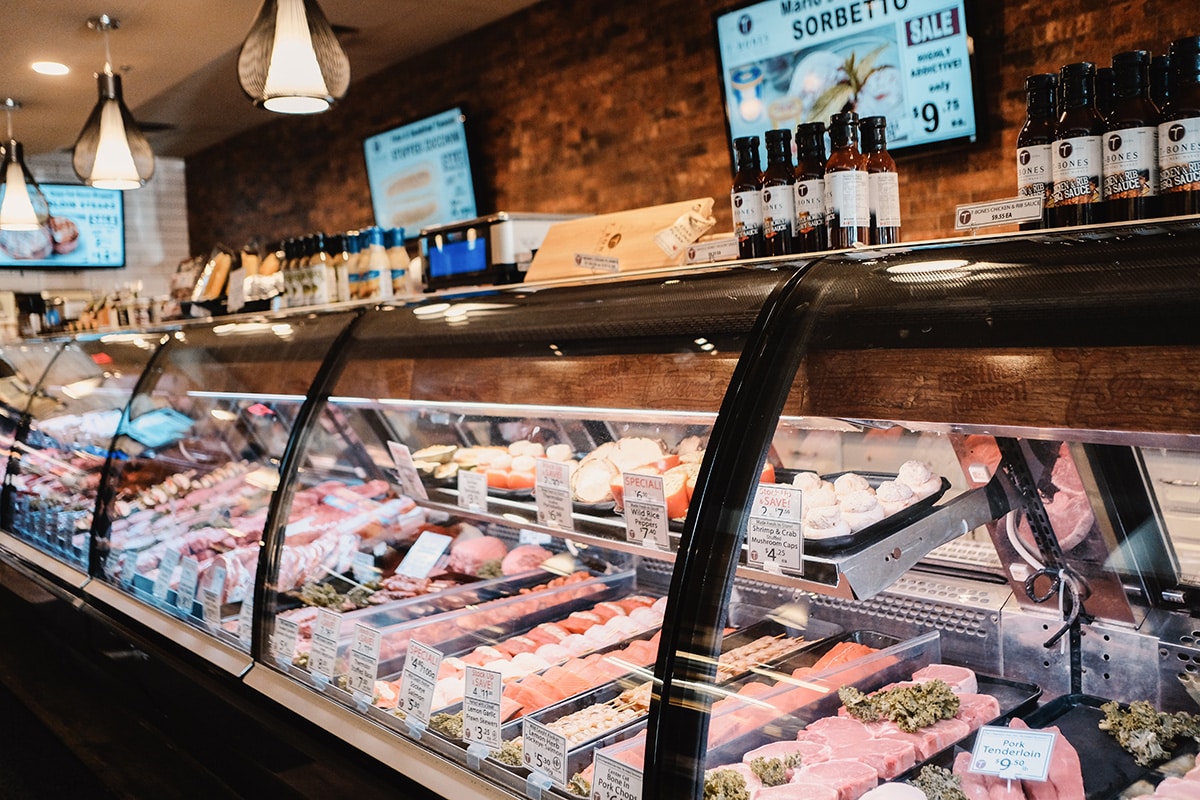 Local business butcher shop display case with fresh meats featured in Marketing Kelowna strategies to drive revenue and increase customer loyalty